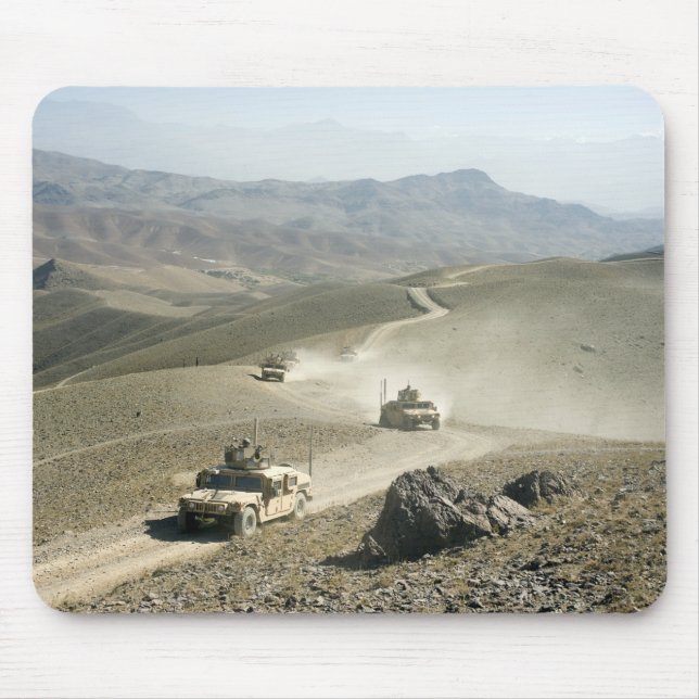 Humvees traverse rugged mountain roads mouse pad (Front)