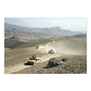 Humvees traverse rugged mountain roads photo print