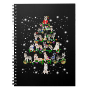 Husky Christmas Tree Covered By Flashlight Notebook