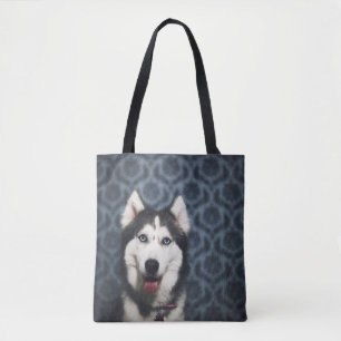 Husky Puppy Posing with a Dark Bakground Tote Bag