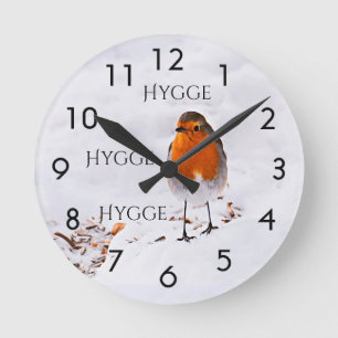 Hygge with a cute Robin bird in snow Round Clock