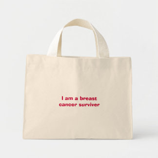 I am a breast cancer surviver mini tote bag