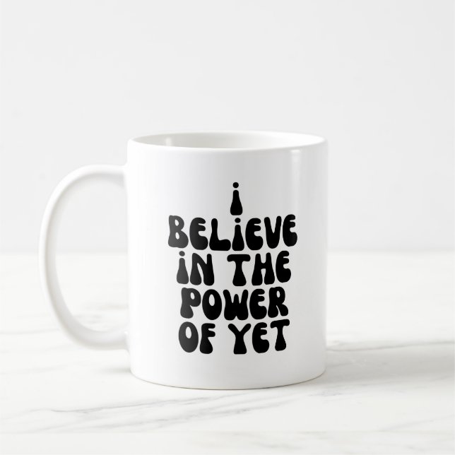I believe in the power of yet coffee mug (Left)