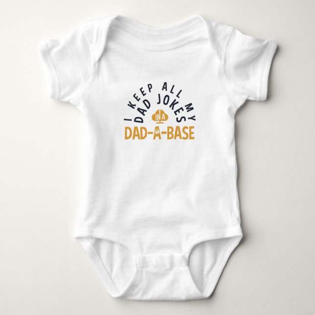 I KEEP ALL MY DAD JOKES IN MY DAD-DA-BASE BABY BODYSUIT (Front)
