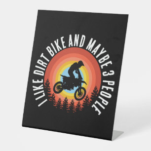 I LIKE DIRT BIKE AND MAYBE 3 PEOPLE PEDESTAL SIGN