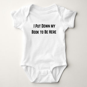 I Put My Book Down to Be Here Black  Baby Bodysuit