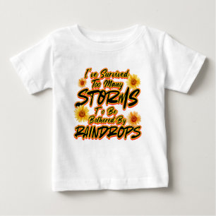 I SURVIVED TOO MANY STORMS TO BE BOTHERED BY  BABY T-Shirt