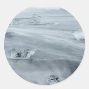 Ice and water on a beach, iceland classic round sticker