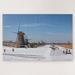 Ice skating along the windmills in winter jigsaw puzzle