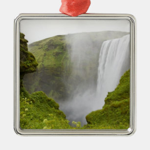 Iceland. Skogarfoss Waterfall plunges over a Metal Ornament