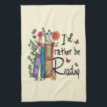 I'd Rather Be Reading Tea Towel<br><div class="desc">This cute and colourful floral design features the words "I'd Rather Be Reading" with pretty colourful books surrounded by flowers. It is a perfect gift for librarian and book lover friends and family members.</div>