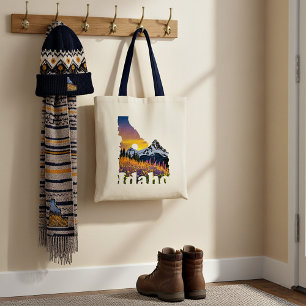Idaho shape with mountain and wildflowers tote bag