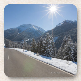 Idyllic empty road thrugh a winter landscape, 2 coaster