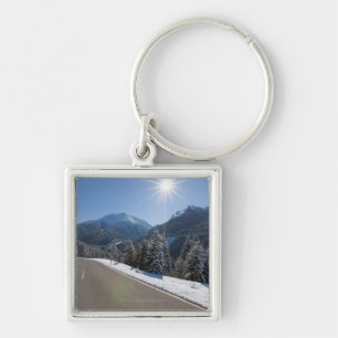 Idyllic empty road thrugh a winter landscape, 2 key ring