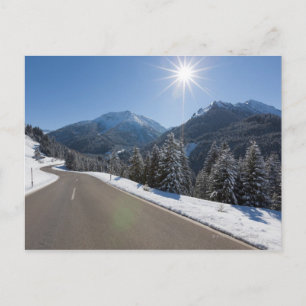 Idyllic empty road thrugh a winter landscape, 2 postcard