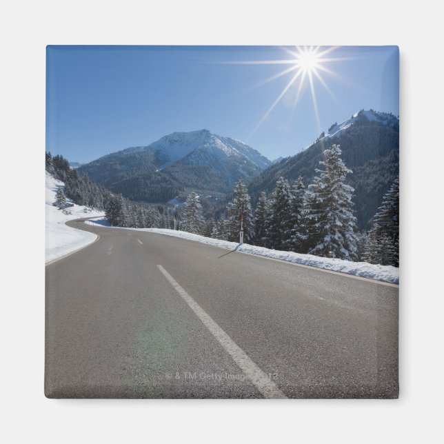 Idyllic empty road thrugh a winter landscape, magnet (Front)