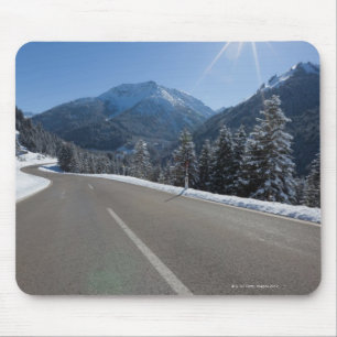 Idyllic empty road thrugh a winter landscape, mouse pad