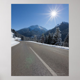 Idyllic empty road thrugh a winter landscape, poster