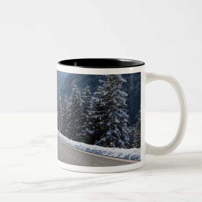 Idyllic empty road thrugh a winter landscape, Two-Tone coffee mug (Right)