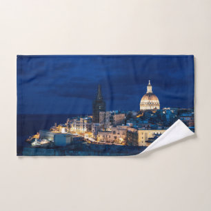 Illuminated at night Valletta old town and harbor Hand Towel