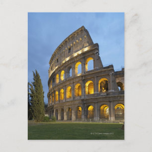 Illuminated section of the Colosseum at dusk. Postcard