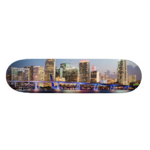 Illuminated skyline of downtown Miami at dusk Skateboard