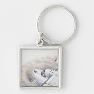 Illustration of a plane flying above wormhole key ring
