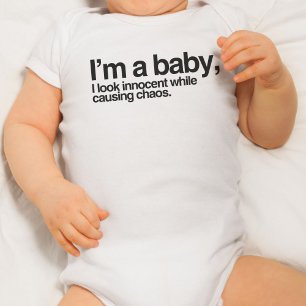 I'm a baby, of course I look innocent while... Baby Bodysuit