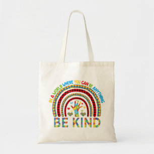 In a world where you can be anything kindness rain tote bag