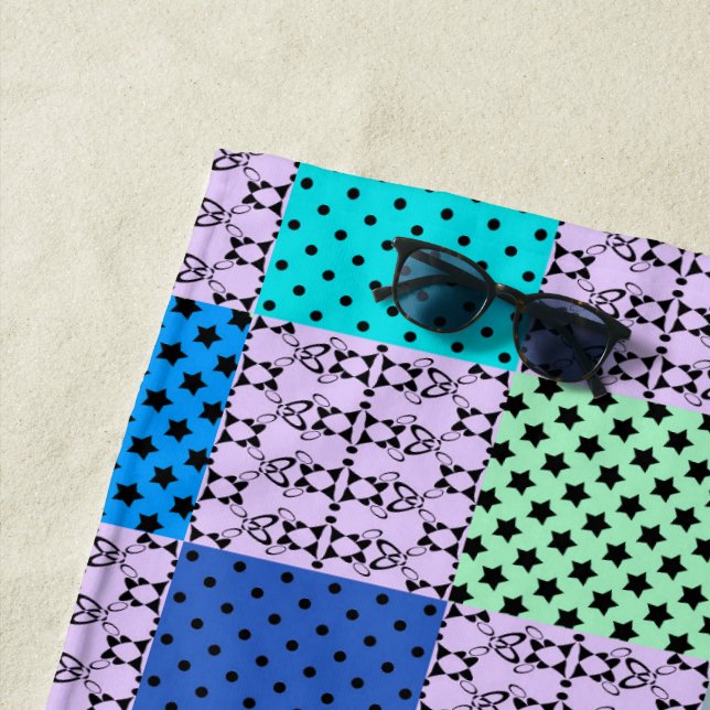 In dark multi-coloured tones, retro geometric beach towel (In Situ)