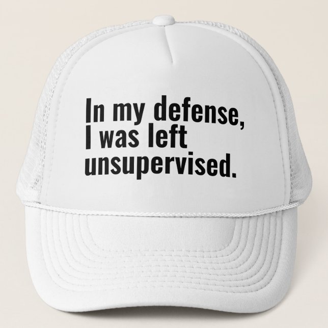 In my defence, I was left unsupervised funny text Trucker Hat (Front)