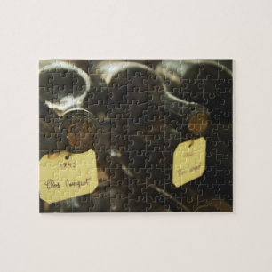 In the underground wine cellar: lying bottles in jigsaw puzzle