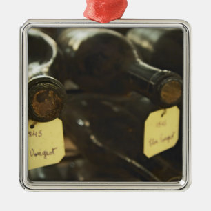 In the underground wine cellar: lying bottles in metal ornament