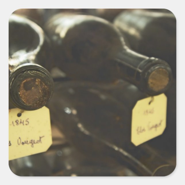 In the underground wine cellar: lying bottles in square sticker (Front)