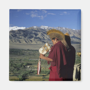 India, Ladakh, Thikse. Buddhist monk blows Magnet