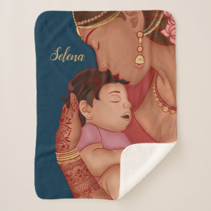 Indian mother holding her baby with henna sherpa blanket