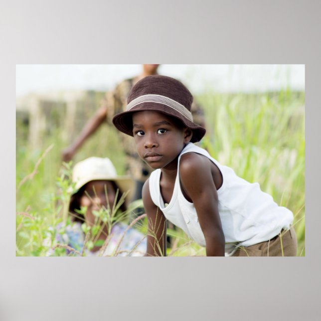 Injured child in the grass. poster (Front)