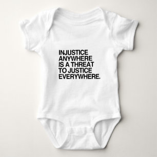 INJUSTICE ANYWHERE IS A THREAT TO JUSTICE -.png Baby Bodysuit