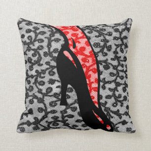 Interesting leg on black high heel shoe red lace cushion