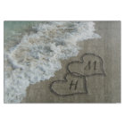 Interlocking Hearts on Beach Sand