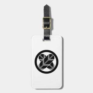 Intersecting hawk feathers in circle luggage tag