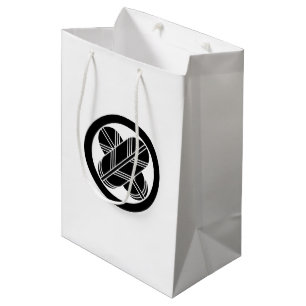 Intersecting hawk feathers in circle medium gift bag