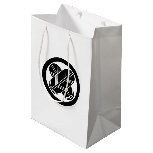 Intersecting hawk feathers in circle medium gift bag (Front Angled)
