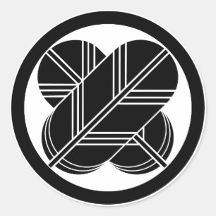 Intersecting hawk feathers with foot in circle classic round sticker