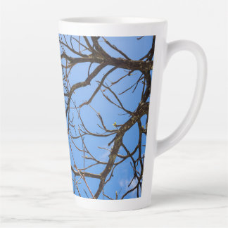 Intricate Bare Branches Silhouette Against Vivid B Latte Mug