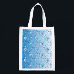Intricate blue and white stars and snowflakes reusable grocery bag<br><div class="desc">Intricate blue and white stars and snowflakes holiday pattern. Need more? Check out other holiday designs at my store! Cheers! :)</div>
