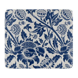 Intricate blue floral pattern on light background cutting board