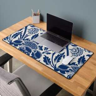 Intricate blue floral pattern on light background desk mat