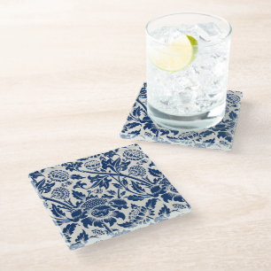 Intricate blue floral pattern on light background glass coaster