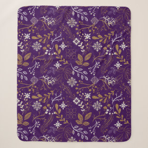 Intricate floral pattern with gold and white sherpa blanket